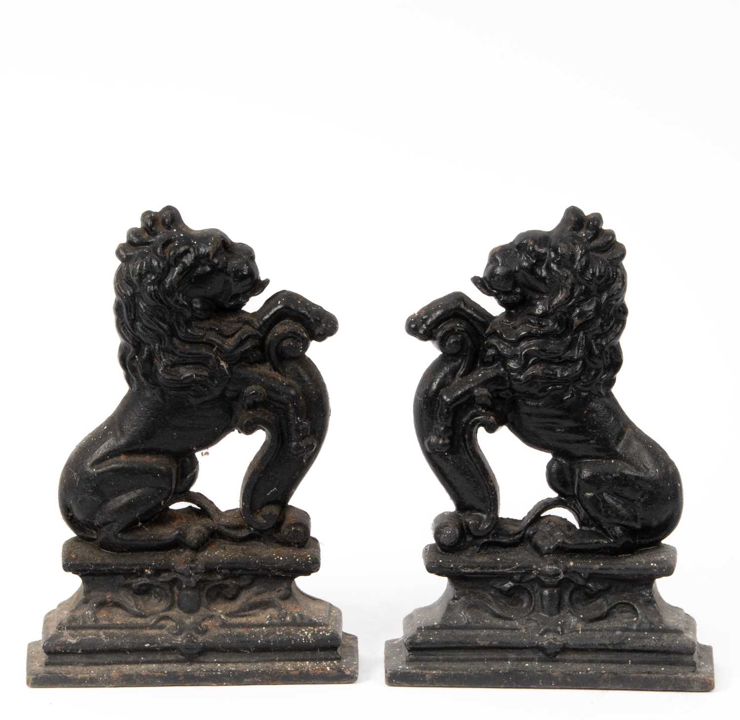 Lot 37 - A pair of cast iron lion door stops