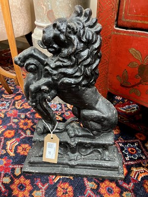 Lot 37 - A pair of cast iron lion door stops