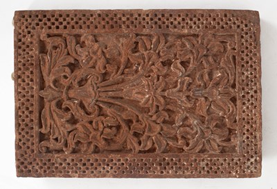 Lot 203 - A stone slab carved with floral designs