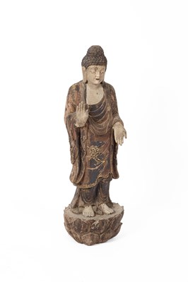 Lot 212 - A carved wooden figure of a standing Buddha