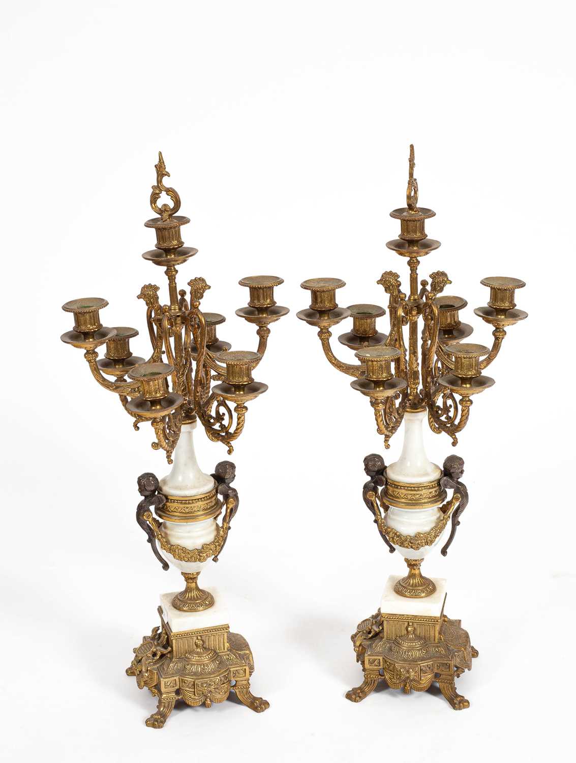 Lot 218 - A pair of Italian Brevettato candelabra