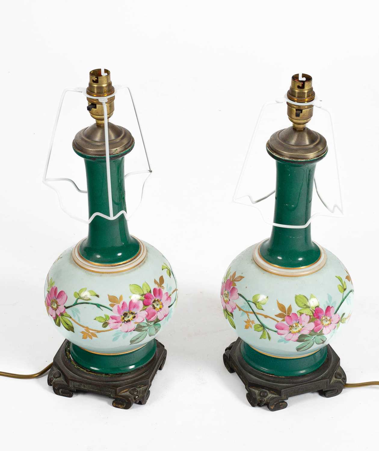 Lot 237 - A pair of green glazed pottery lamps