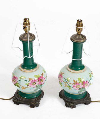 Lot 237 - A pair of green glazed pottery lamps