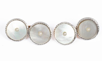 Lot 404 - A pair of 9ct gold and mother-of-pearl dress cufflinks