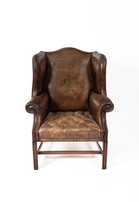 Lot 486 - A George III style wing armchair