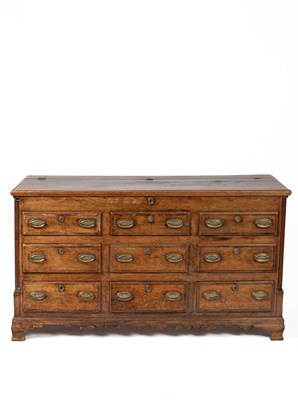 Lot 509 - A George III oak and mahogany crossbanded mule chest