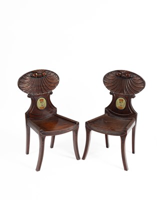 Lot 512 - A pair of Regency mahogany shell back hall chairs