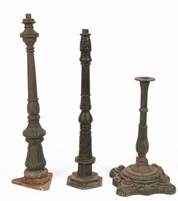 Lot 453 - Three painted cast iron garden lamp stands