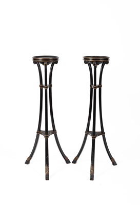 Lot 593 - A pair Regency style black and gilt painted torchères