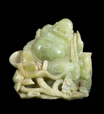 Lot 256 - A carved bowenite Budai