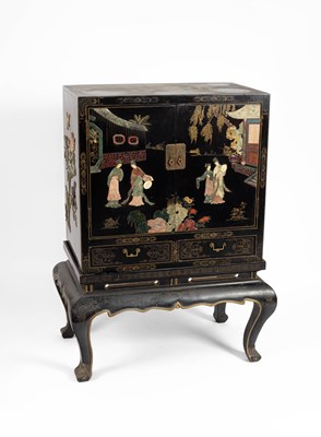 Lot 268 - A 20th Century black lacquer and jadeite applied cabinet on stand