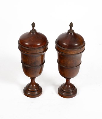 Lot 271 - A pair of modern acacia urns with covers