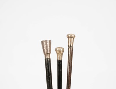 Lot 275 - Three silver capped walking canes