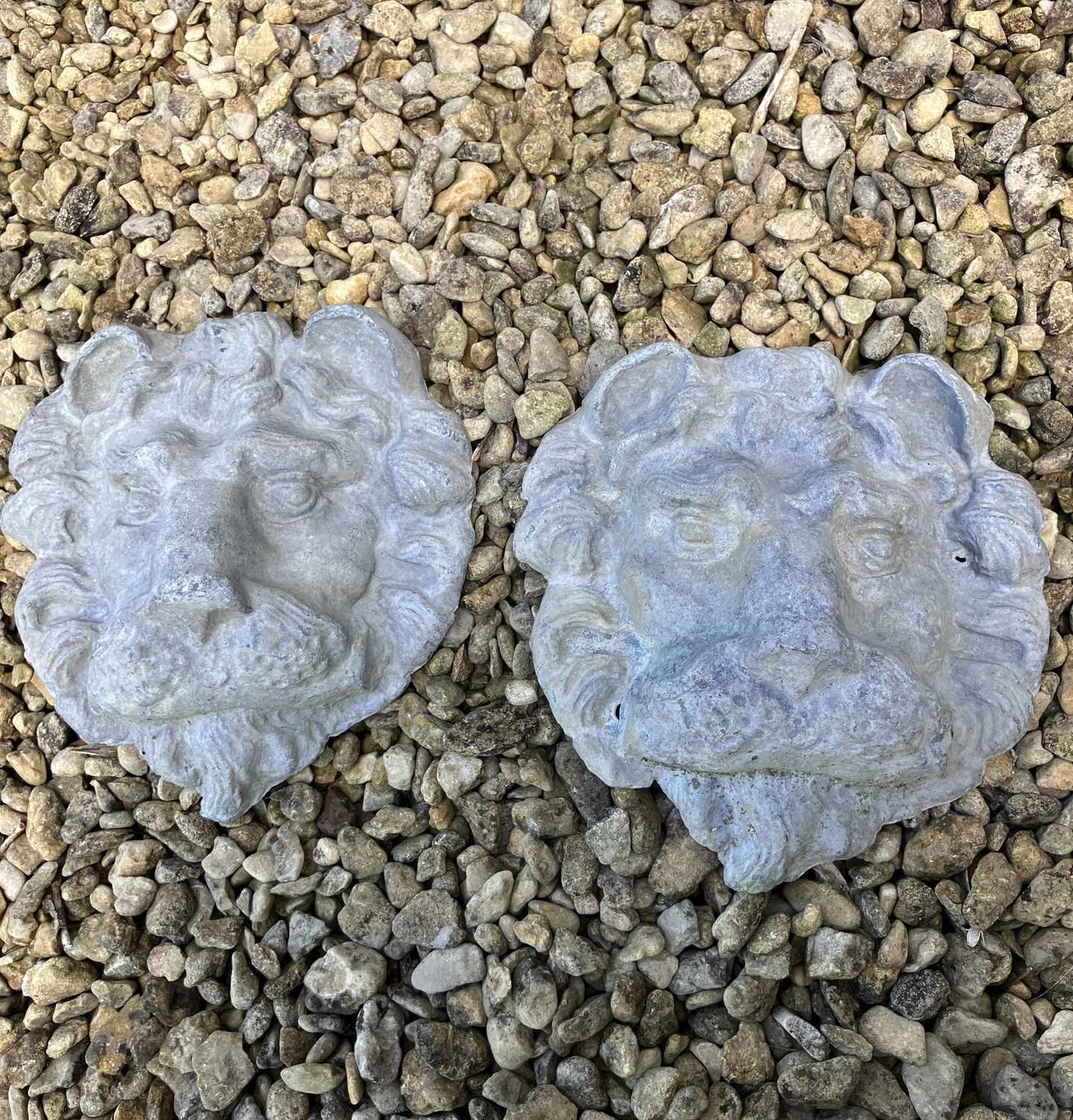 Lot 42 - A pair of cast lead lion masks