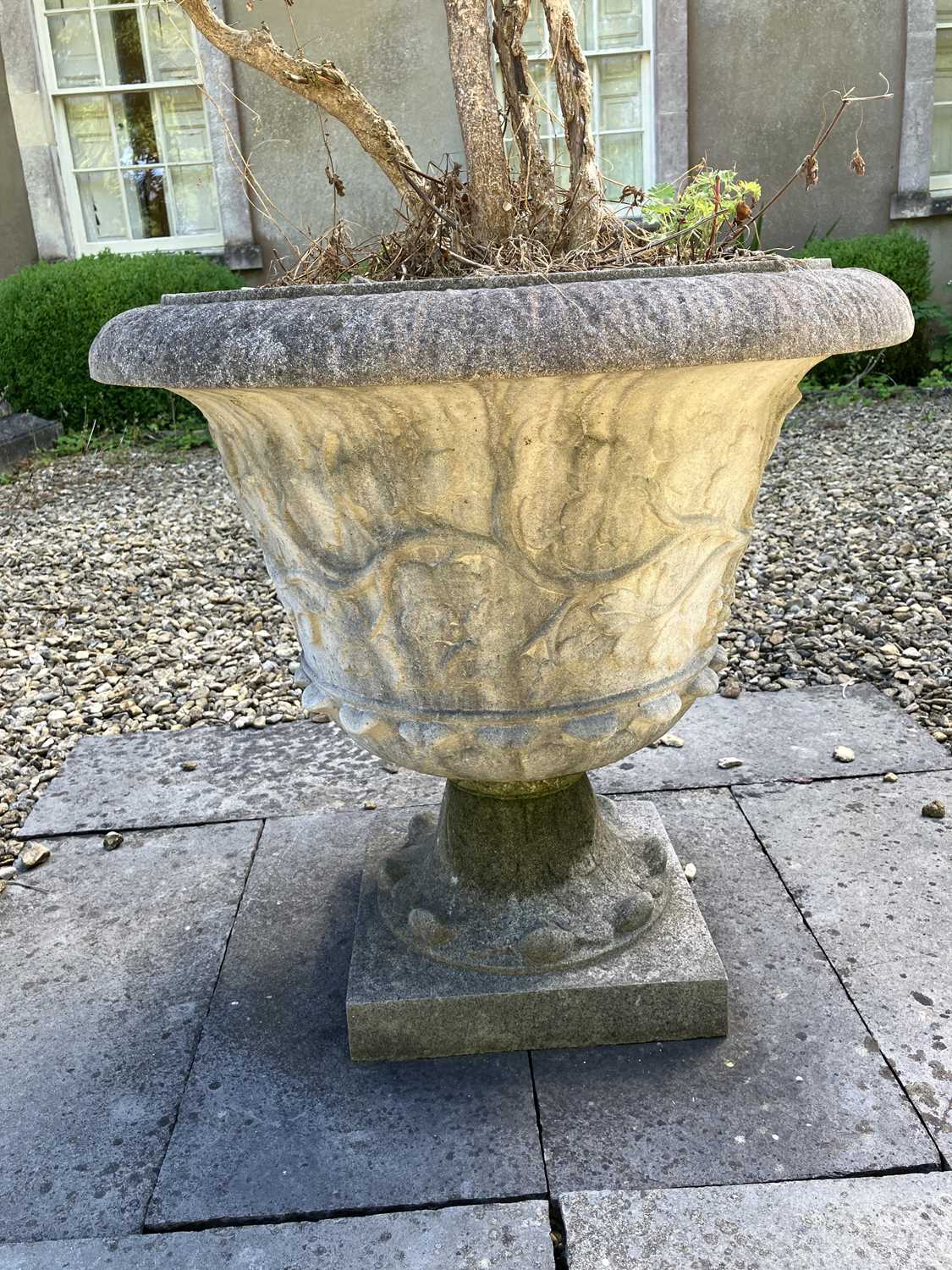 Lot 44 - A pair of reconstituted stone urns