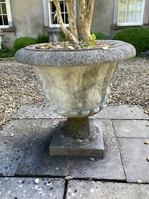 Lot 44 - A pair of reconstituted stone urns