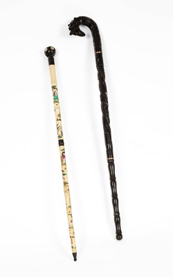 Lot 568 - A Chinese bone walking cane