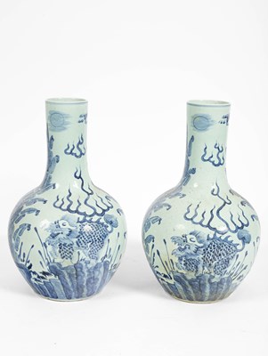 Lot 606 - A pair of Chinese blue and white baluster vases