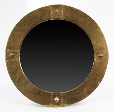 Lot 576 - An Arts & Crafts hammered copper circular mirror