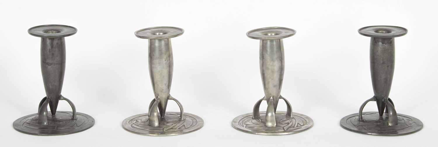Lot 578 - Archibald Knox for Liberty & Co. four pewter candlesticks