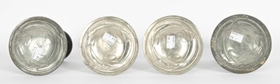 Lot 578 - Archibald Knox for Liberty & Co. four pewter candlesticks