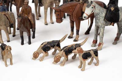 Lot 57 - A carved and painted group of fox hunting figures