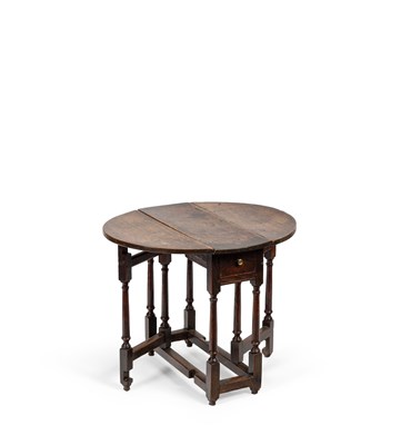 Lot 24 - A small George I oak gateleg table