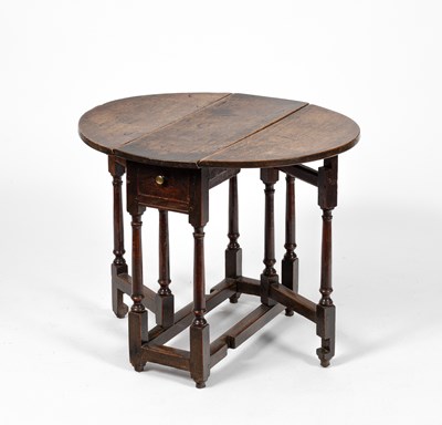Lot 24 - A small George I oak gateleg table