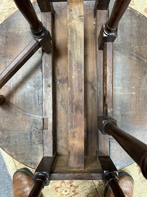 Lot 24 - A small George I oak gateleg table
