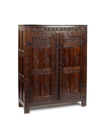 Lot 26 - A Charles II carved oak two door cupboard