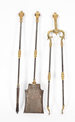 Lot 8 - A set of three brass mounted burnished steel fire irons