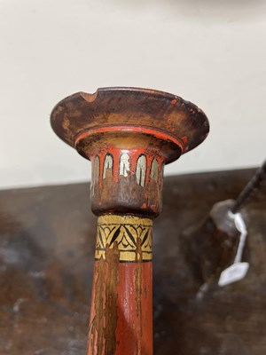 Lot 28 - A pair of red lacquer candlesticks