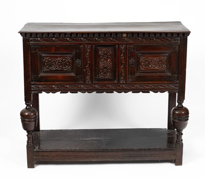 Lot 34 - A James I oak livery cupboard