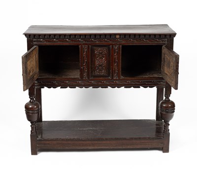 Lot 34 - A James I oak livery cupboard