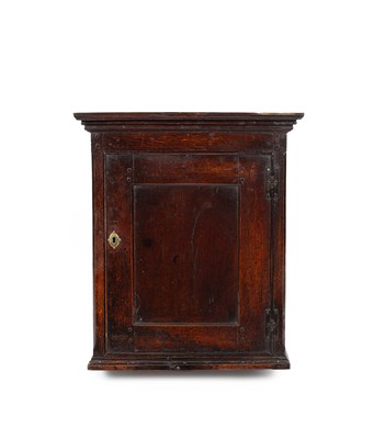 Lot 36 - A George II oak hanging cupboard