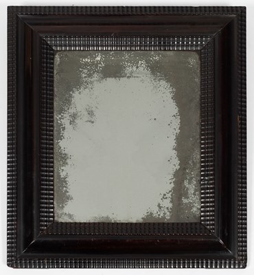 Lot 60 - A Dutch ebonised and ripple moulded mirror