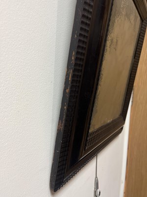 Lot 60 - A Dutch ebonised and ripple moulded mirror