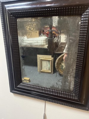 Lot 60 - A Dutch ebonised and ripple moulded mirror