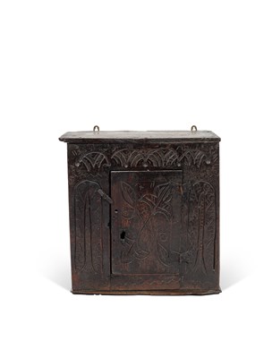 Lot 12 - A small Charles II oak hanging cupboard