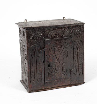 Lot 12 - A small Charles II oak hanging cupboard