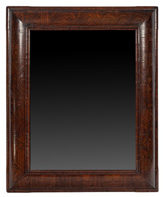 Lot 13 - A large William & Mary figured walnut cushion frame mirror