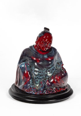 Lot 412 - A Royal Doulton 'The Smiling Buddha' flambé glazed sung ware figure