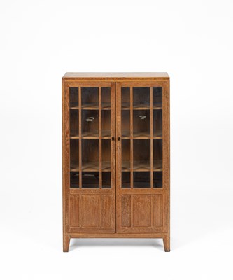 Lot 577 - An Arts & Crafts style limed oak bookcase