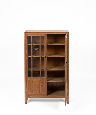 Lot 577 - An Arts & Crafts style limed oak bookcase