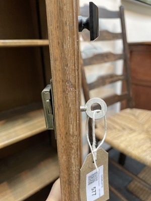 Lot 577 - An Arts & Crafts style limed oak bookcase