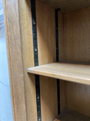 Lot 577 - An Arts & Crafts style limed oak bookcase