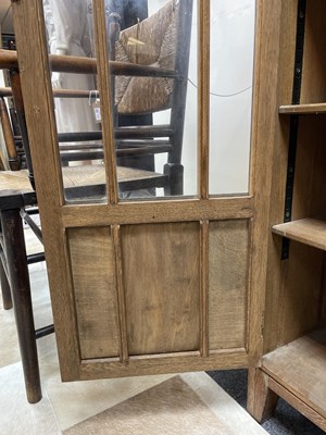 Lot 577 - An Arts & Crafts style limed oak bookcase