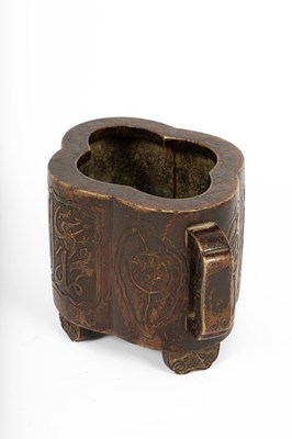 Lot 572 - An Arabic inscribed quatrefoil-shaped bronze incense burner