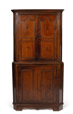 Lot 121 - A George IV oak standing corner cupboard