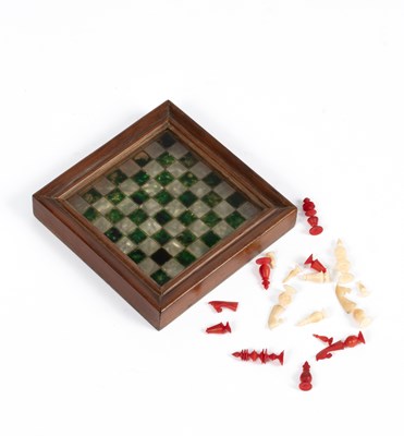 Lot 562 - A miniature travel chess set